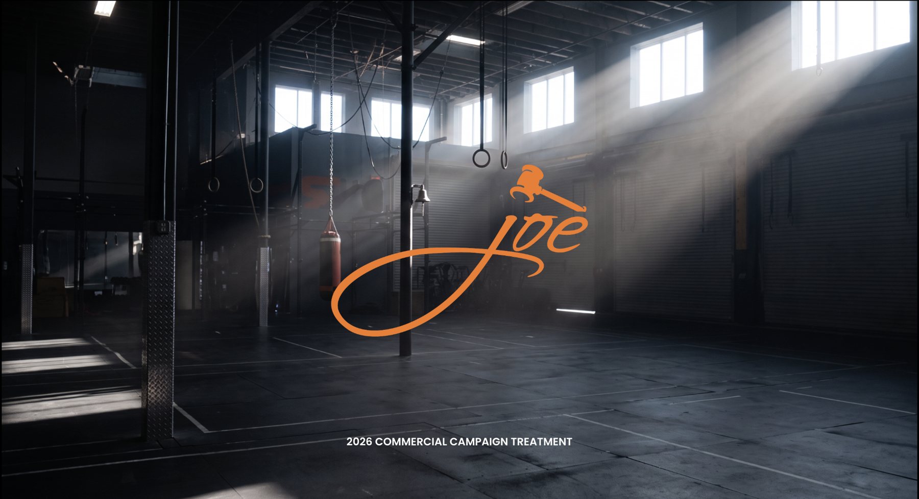 Empty industrial gym, shafts of light, Joe logo